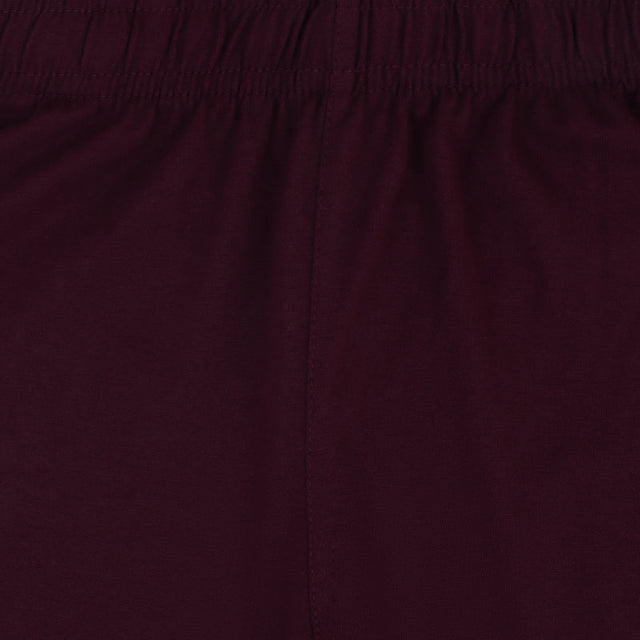 Close-up of maroon kids innerwear fabric with elastic waistband and soft texture