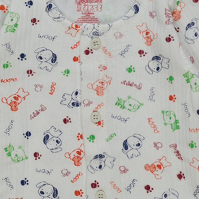 Close-up of baby innerwear with colorful puppy and paw print design, front button closure