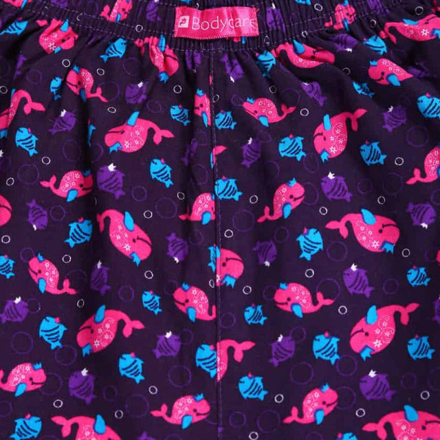 Close-up of kids' innerwear with purple fabric, pink and blue cartoon fish, elastic waistband