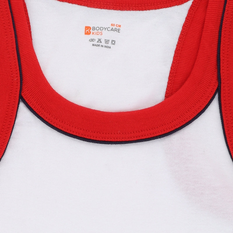 Kids white cotton vest with red trim, close-up of neckline and soft fabric