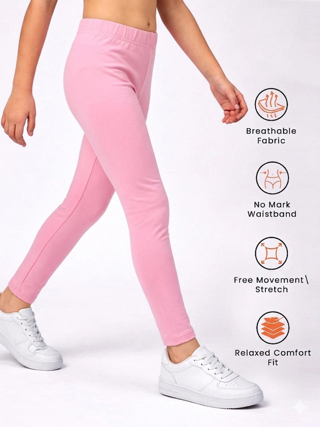 Girl wearing pink leggings for kids, elastic waist, breathable, stretch, relaxed fit, white shoes