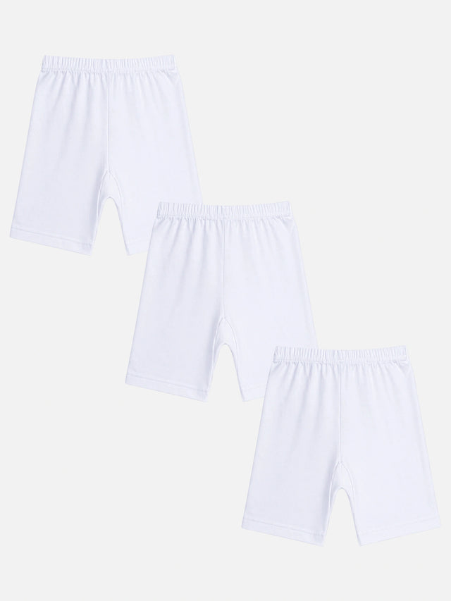 Set of three white kids cotton innerwear shorts with elastic waistband on white background