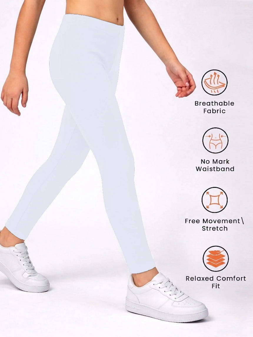 Child wearing white leggings with breathable fabric, stretch fit, and comfort waistband features