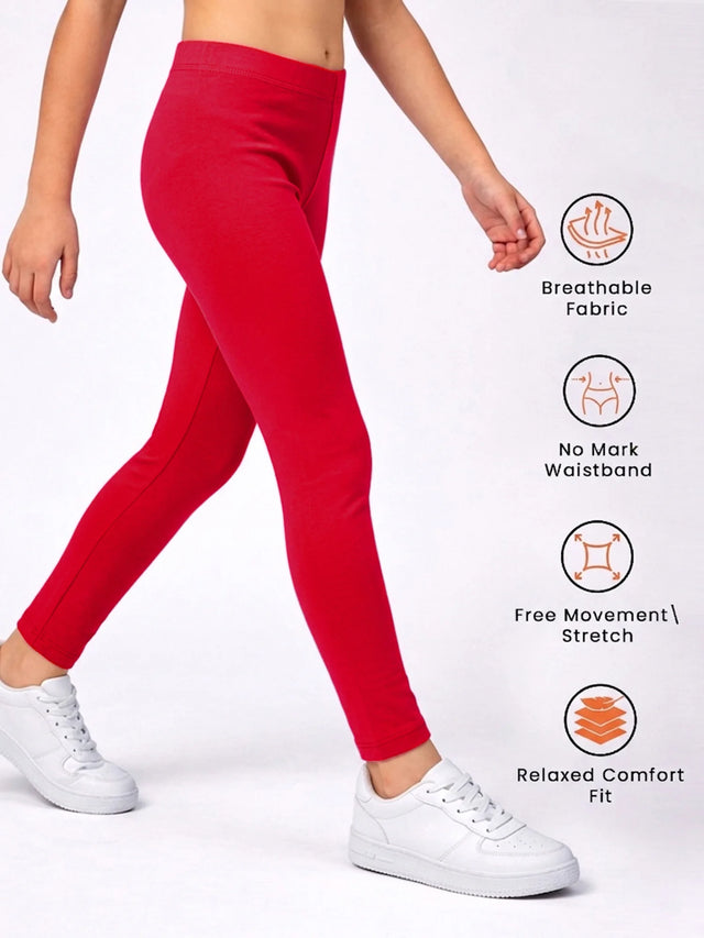 Kid wearing red leggings with breathable fabric, no mark waistband, stretch, and comfort fit icons