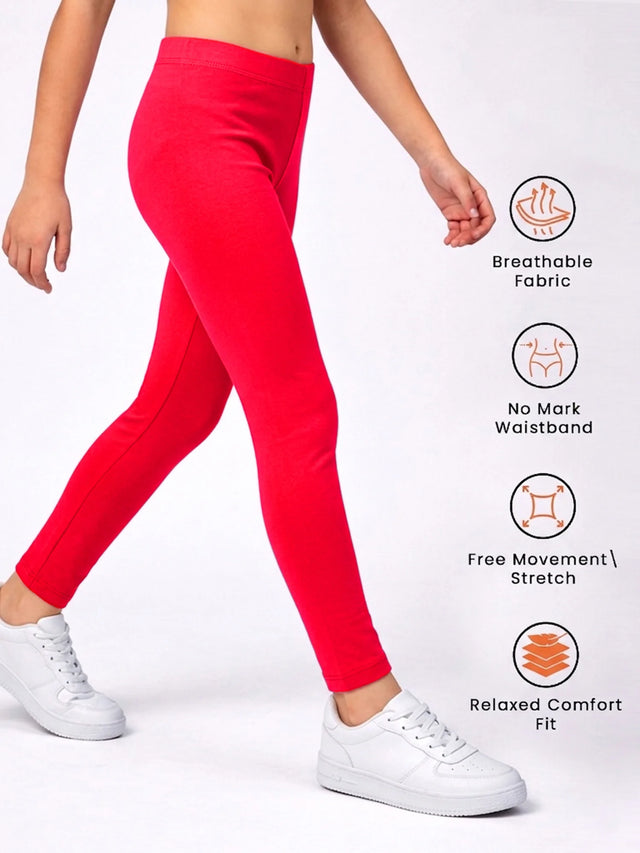 Girl wearing bright red leggings with breathable fabric, stretch, and no mark waistband features