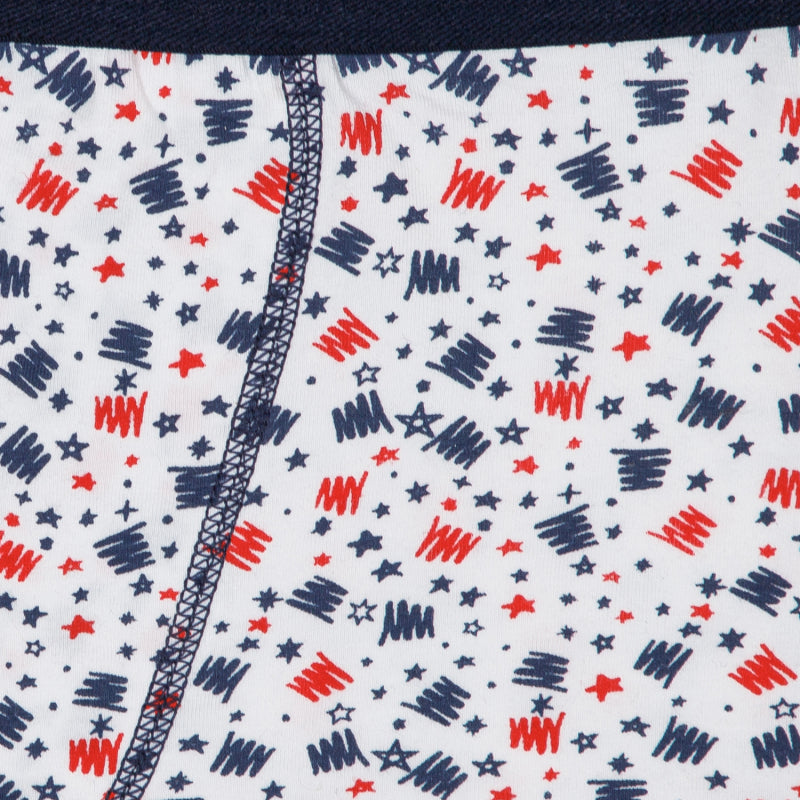 Close-up of kids innerwear fabric with red and navy star and scribble print pattern