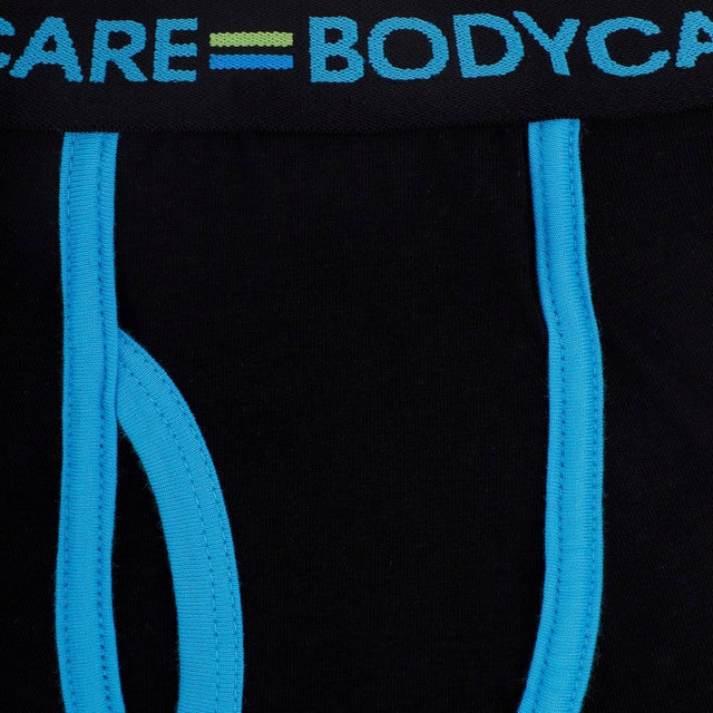 Black kids innerwear with blue seams and elastic waistband, close-up view