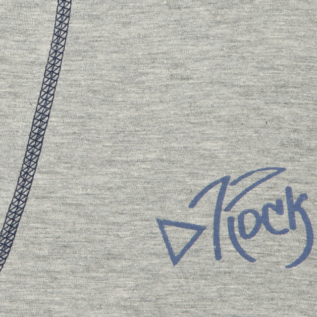 Closeup of light grey kids innerwear fabric with blue print and dark stitched seam