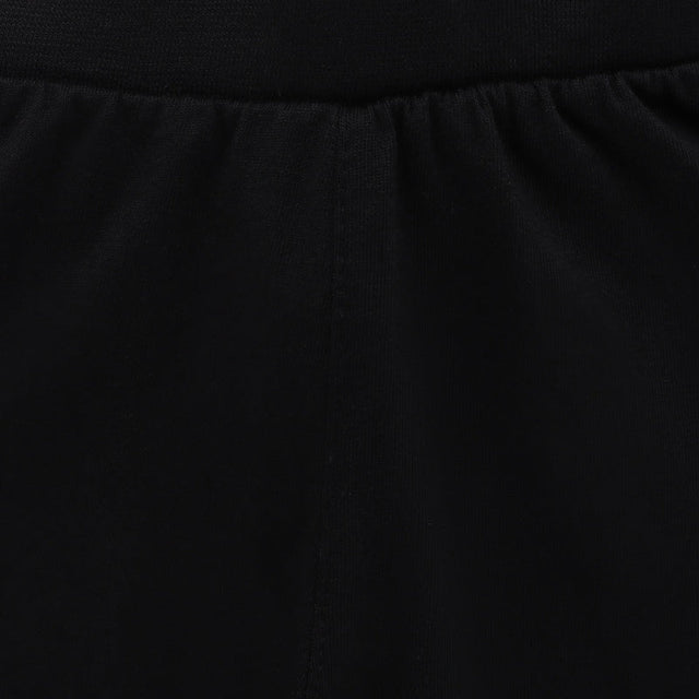 Close-up of black kids innerwear fabric with elastic waistband and soft texture