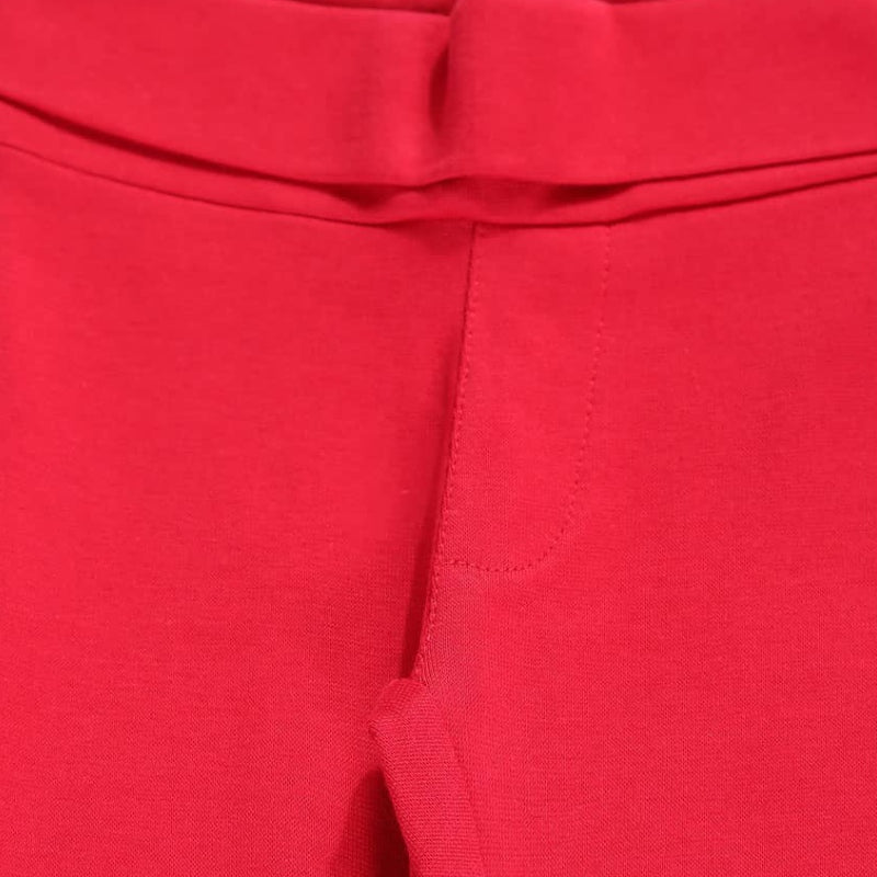 Close-up of red kids' thermal innerwear waistband and stitching detail