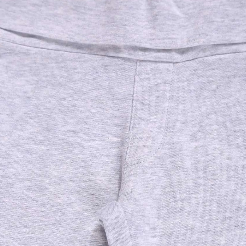 Close-up of light grey kids innerwear fabric with soft stitching and elastic waistband.
