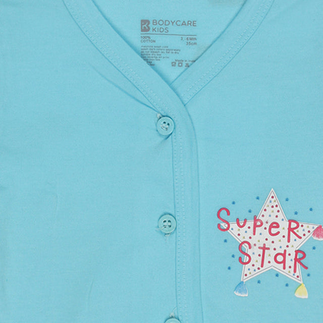 Light blue baby cotton vest with front buttons and a star print reading Super Star