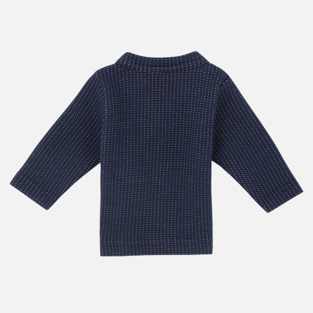 Navy blue kids thermal top with long sleeves and subtle dotted pattern, back view