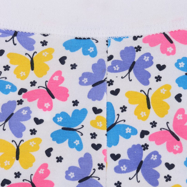 Close-up of kids' innerwear fabric with colorful butterfly print and black heart motifs