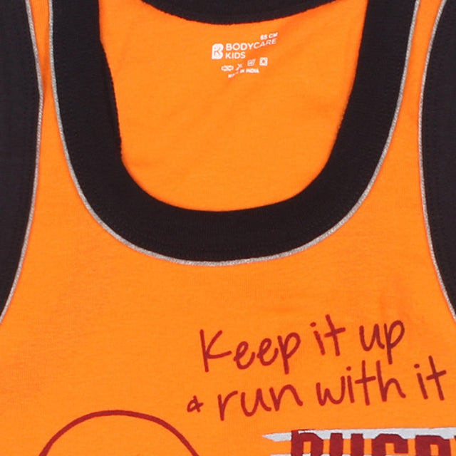 Orange kids sleeveless vest with black trim and motivational text print