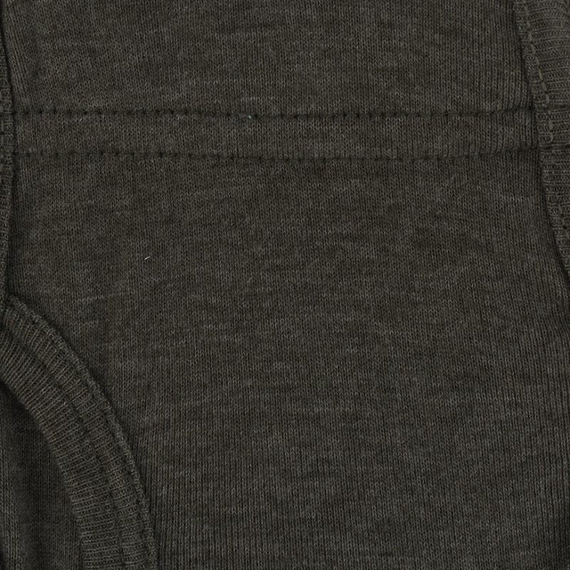Close-up of dark grey kids innerwear fabric showing stitching details
