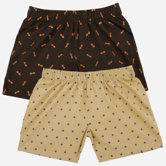 Kids boxer shorts multipack, one black with orange print, one beige with star pattern