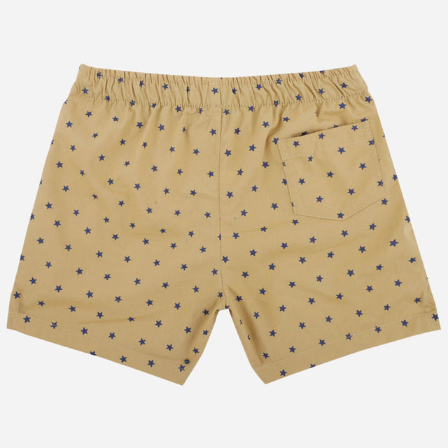 Beige kids boxer shorts with navy blue star print, elastic waistband, and back pocket