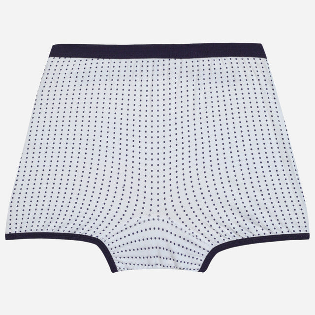 Kids polka dot printed cotton underwear with navy elastic waistband and trim on white background