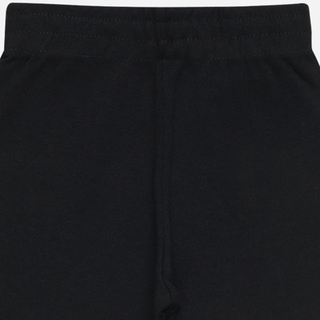 Close-up of black kids thermal pants with elastic waistband, soft winter innerwear