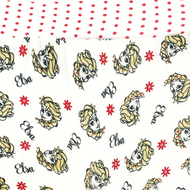 Close-up of kids’ innerwear fabric with cartoon character faces, red snowflakes, and red polka dots.