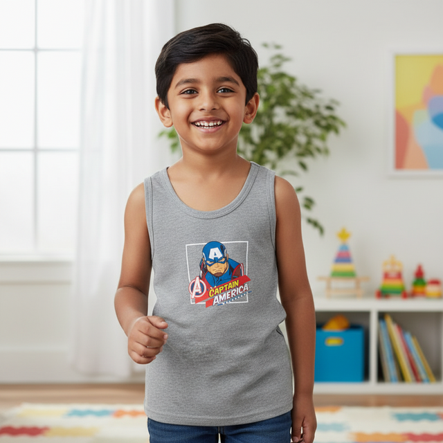 Smiling boy in grey Captain America sleeveless vest top, kids innerwear, indoor setting
