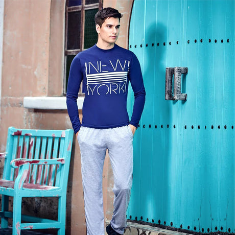 Man wearing casual long-sleeve t-shirt and joggers, showcasing fit and style for everyday menswear