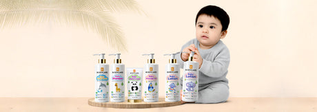 Bodycare baby care products including shampoo, body wash, lotion and massage oil displayed with baby