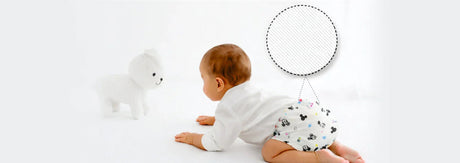 Baby crawling in soft printed diaper and innerwear, showing comfort, fit and flexible stitching