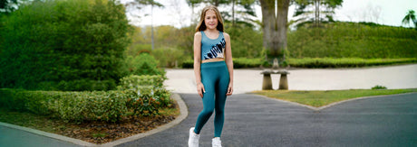 Girl wearing trendy kids casual wear including sleeveless top and leggings, styled outdoors for everyday comfort