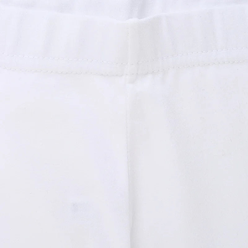 Close-up of white kids innerwear fabric with elastic waistband and soft stitching