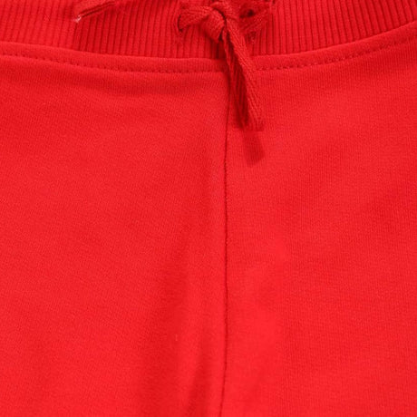 Close-up of red kids apparel waistband with drawstring, soft fabric texture.