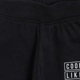 Close-up of black kids thermal wear pants with elastic waistband and white printed design