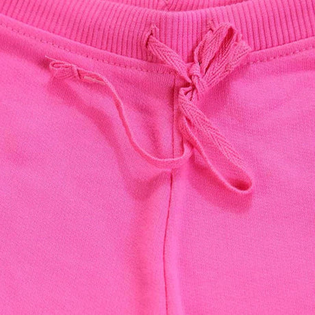 Close-up of pink kids sweatpants with ribbed waistband and drawstring tie