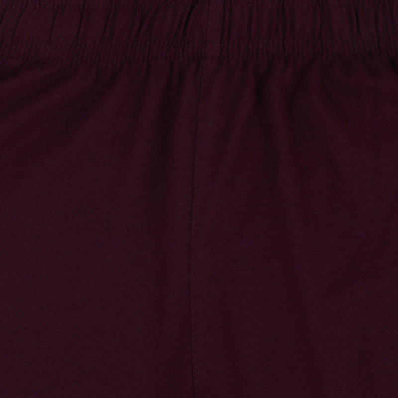 Close-up of maroon kids innerwear fabric with elastic waistband and soft texture