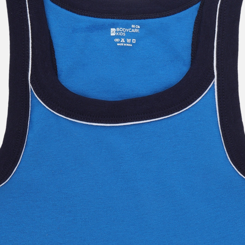 Blue kids' cotton tank top with navy trim and white piping, close-up front view