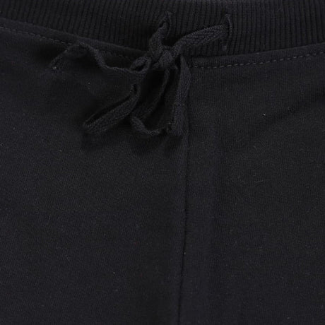 Close-up of black kids joggers with ribbed waistband and drawstring tie