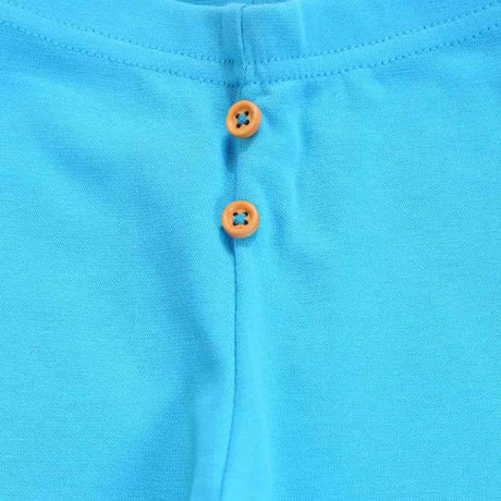 Close-up of blue kids innerwear with two orange buttons on waistband.