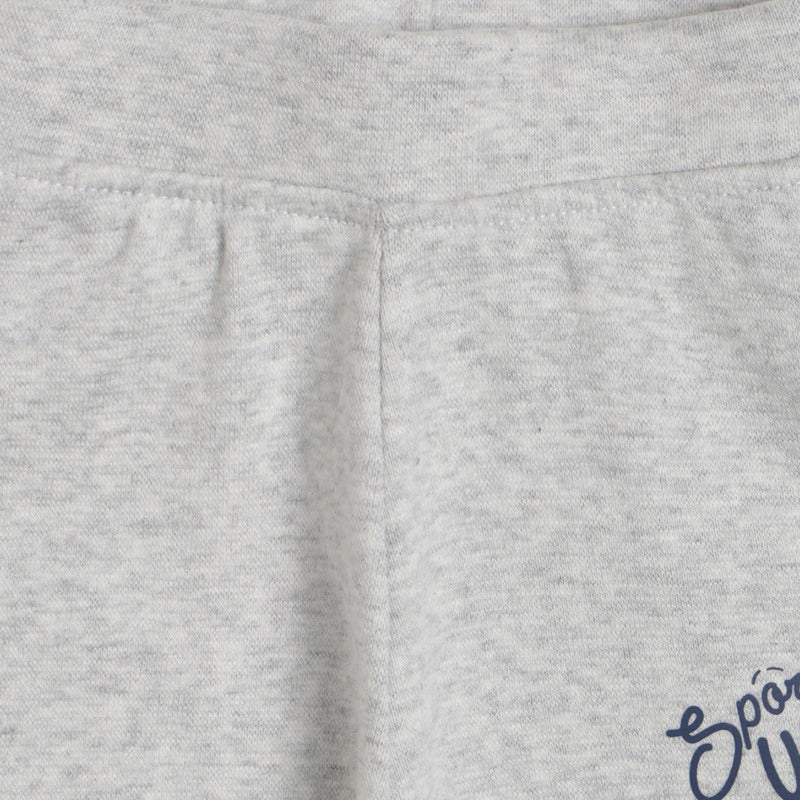Close-up of light grey kids' cotton apparel with soft fabric texture and visible stitching