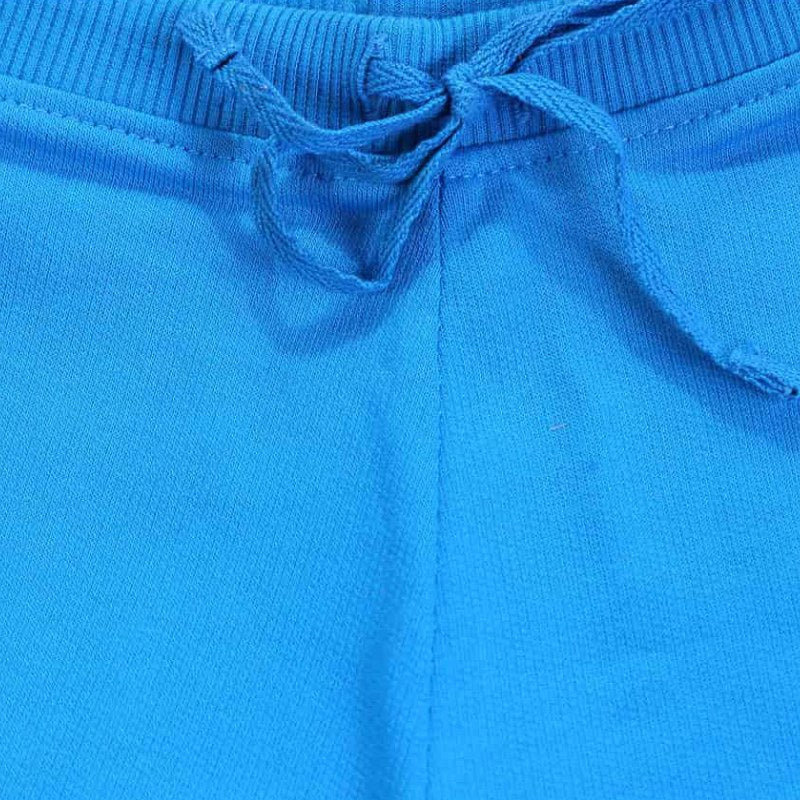 Close-up of blue kids shorts waistband with drawstring, cotton fabric detail