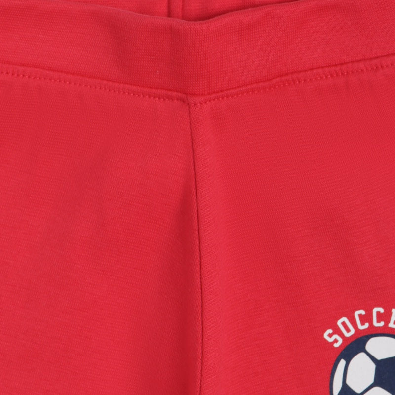 Close-up of red kids innerwear with soccer ball graphic and stitched waistband detail