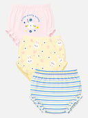 Three pairs of baby bloomers in a three-pack, featuring a pink pair with bunny graphics and text, a pale yellow pair with bunny faces and flowers, and a blue and white striped pair with ruffled edges.