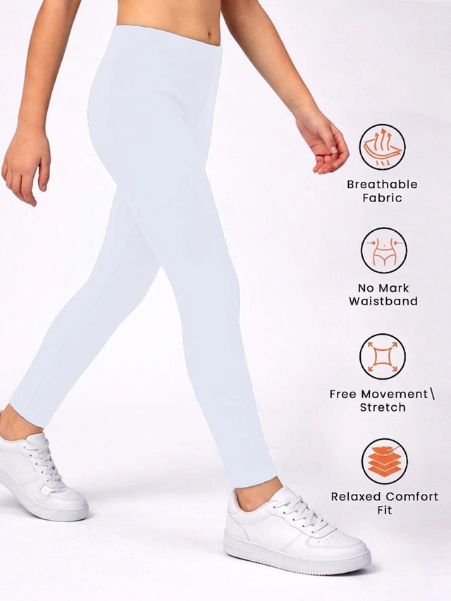 Child wearing white leggings with breathable fabric, stretch fit, and comfort waistband features