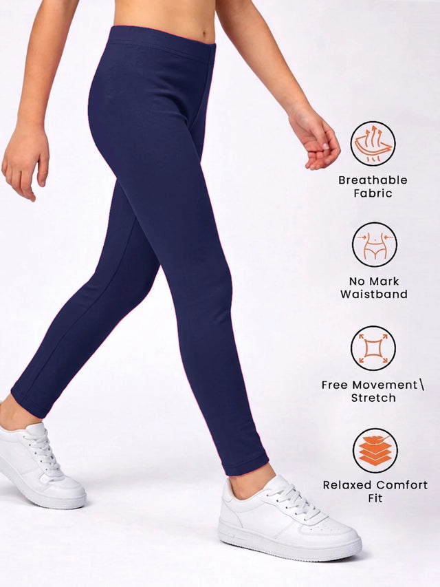 Child wearing navy blue leggings with breathable fabric, stretch, and no mark waistband features