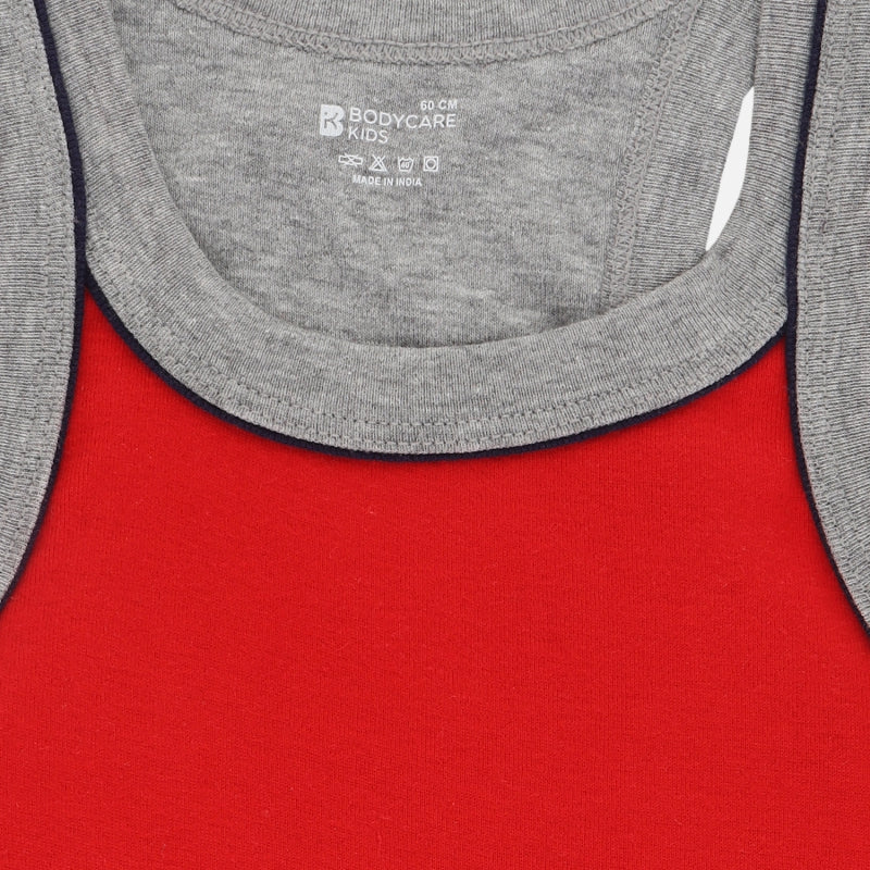 Red kids thermal innerwear with grey ribbed neckline, close-up fabric texture