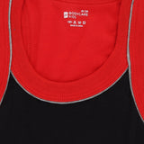 Close-up of kids innerwear tank tops in red and black with contrast trim and care label