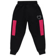 Black kids joggers with pink side panels and rhinestone heart accent, front view
