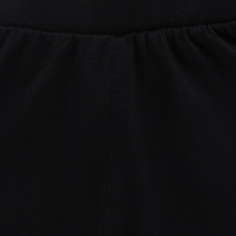 Close-up of black kids innerwear fabric with elastic waistband and soft texture