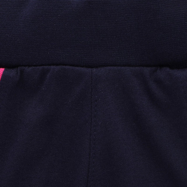 Close-up of navy blue kids innerwear waistband with soft fabric and slight pink accent