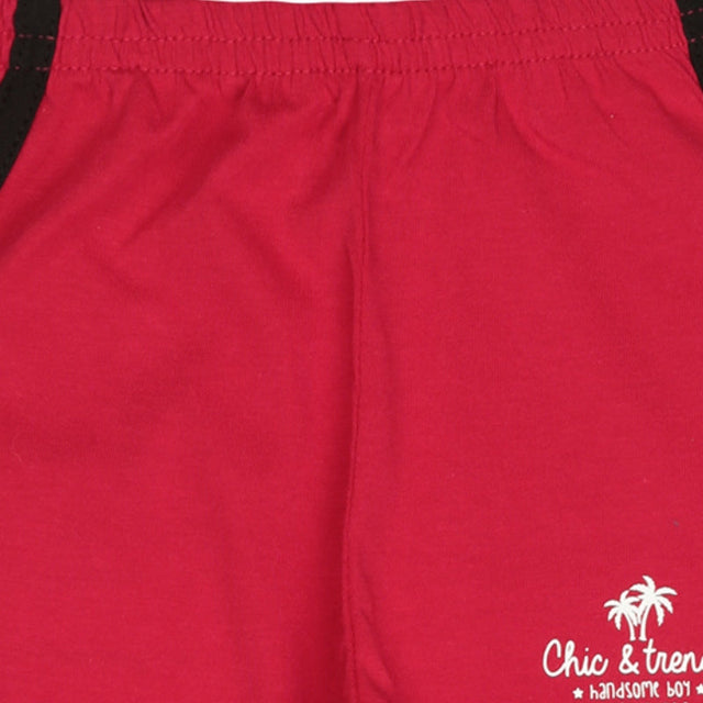 Red kids cotton shorts with white palm tree and text print, elastic waistband, comfortable fit